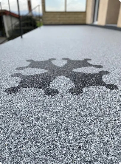 moquette de pierre grise avec motif en forme de crois à Estancarbon près de Saint-Gaudens en Haute-Garonne 31